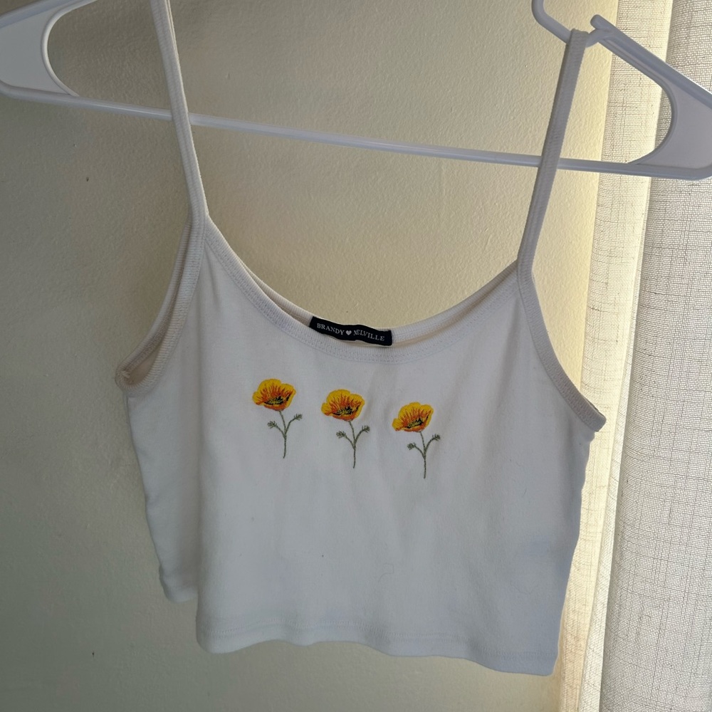 Brandy Melville John Galt white flower Tank Top.